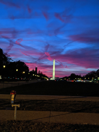 Washington Monument at Dusk with a vibrant skyline